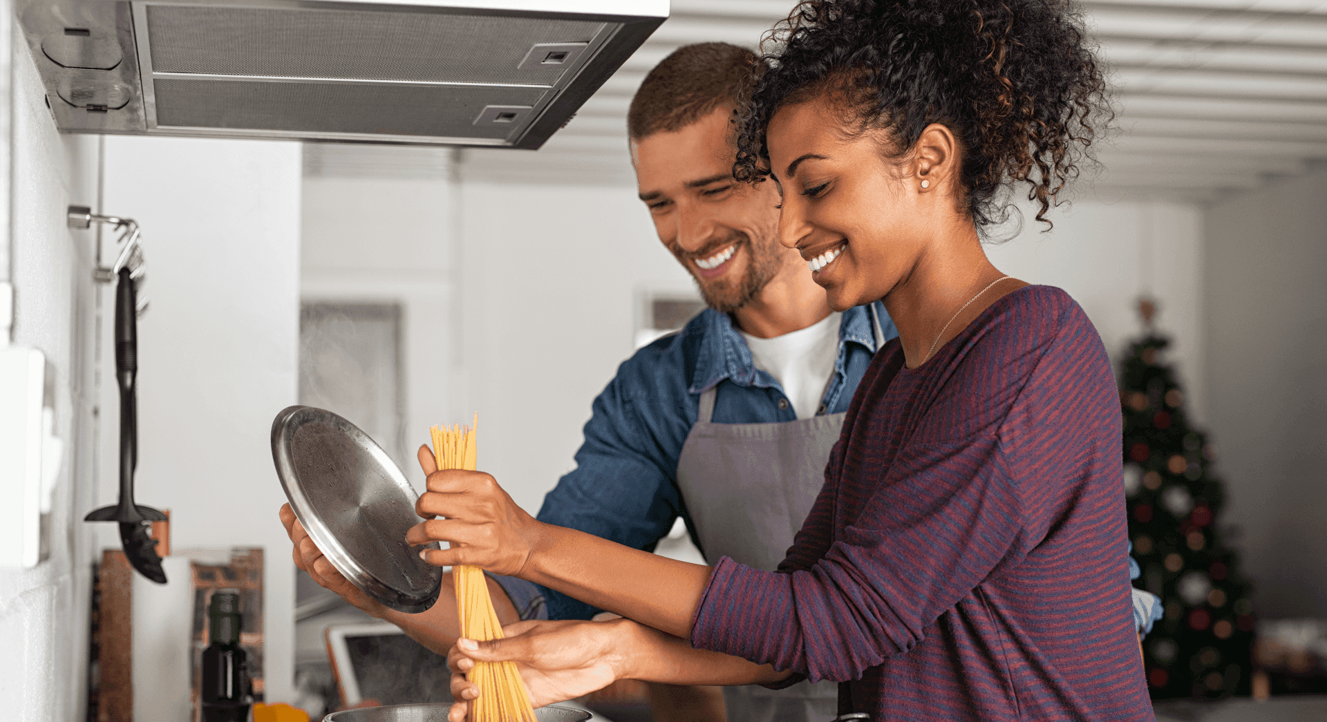 Couple cooking at home with Golden Penny products