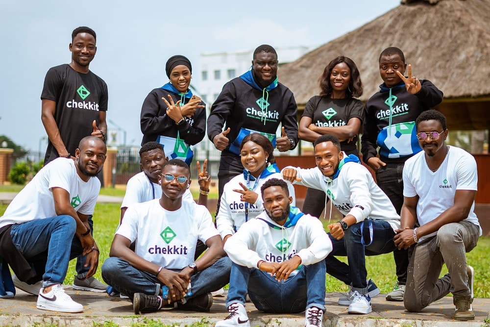 The Chekkit team outdoors in Lagos, wearing Chekkit shirts